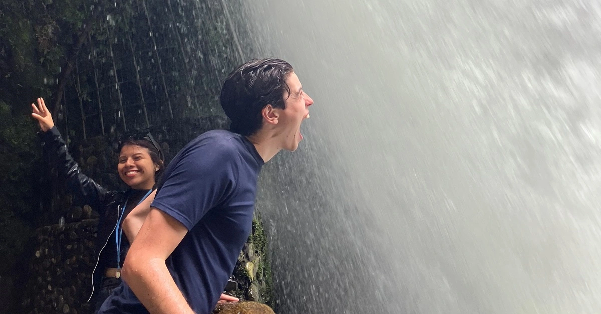Ecuador Intern Screaming at a waterfall